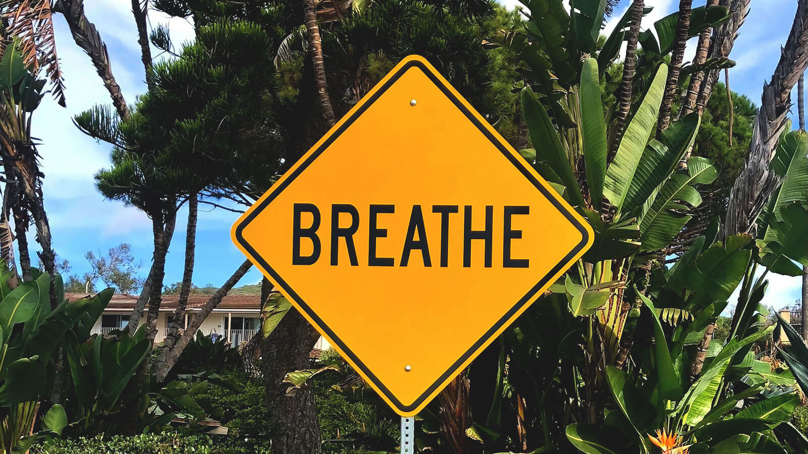 a road sign saying breathe