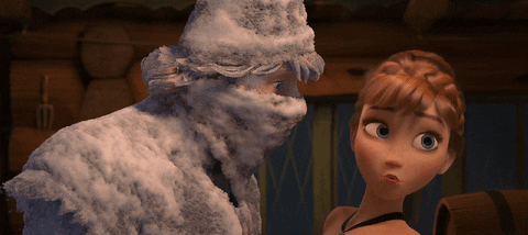 From the movie, "Frozen," Anna side-eyes a frozen Kristoff in the Convenience Store. Kristoff is standing very close to her covered in a thick layer of snow from the storm outside. 