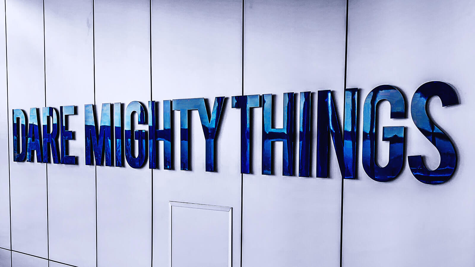a blue sign that says dare mighty things
