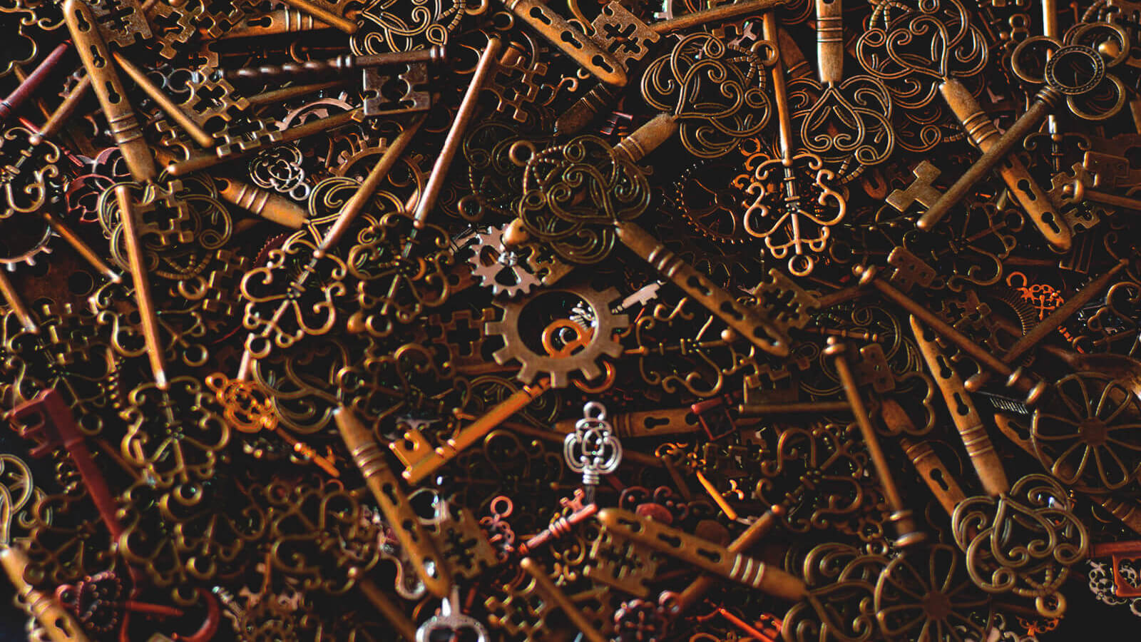 brass keys in a big pile