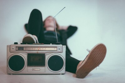 person listening to a boombox