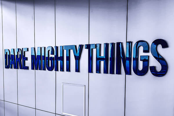 a blue sign that says dare mighty things