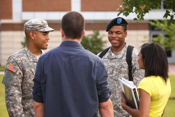 college students talk to ROTC members