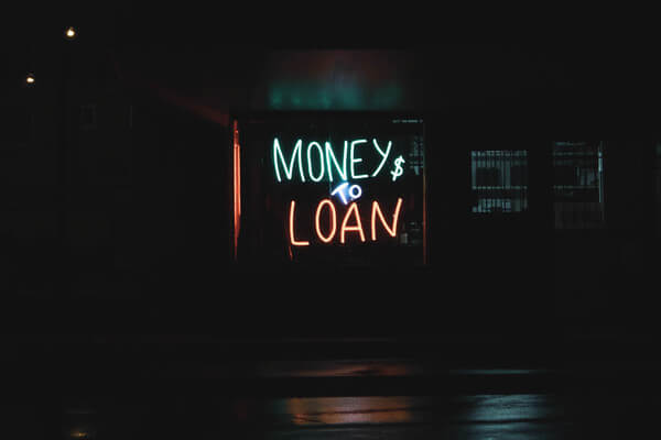 a neon sign saying money to loan