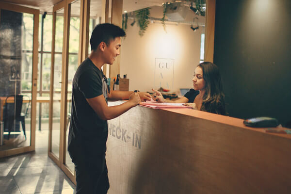 a student works the front desk of a resort